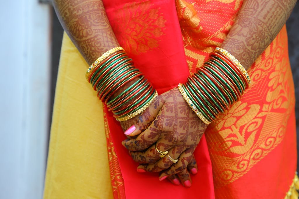 Close-up of Woman Hands with Mehendi and Accessories
