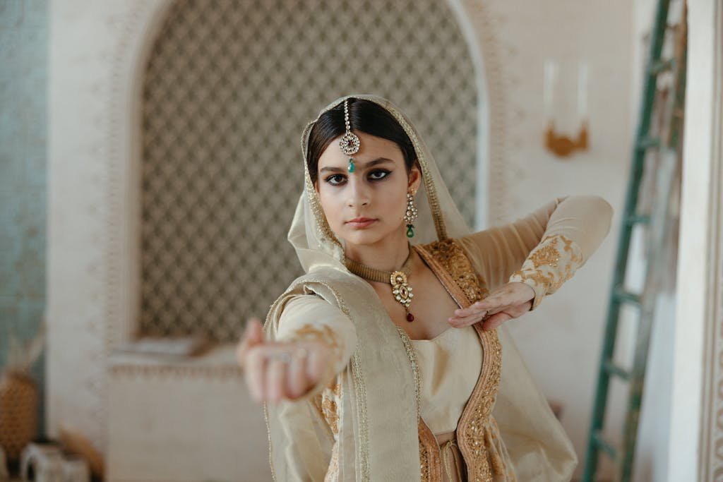 Young Indian Woman in Traditional Clothes Dancing